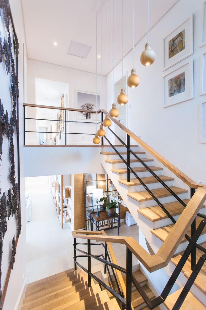 Remodeled staircase with oak treads and custom railing