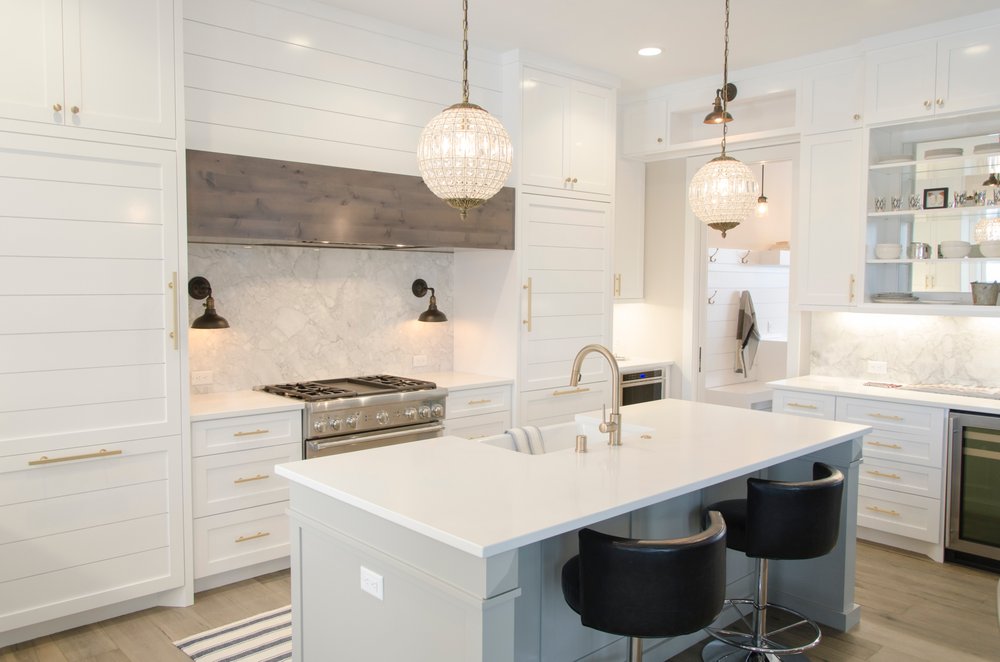 Bright white custom kitchen with island and pendant lighting