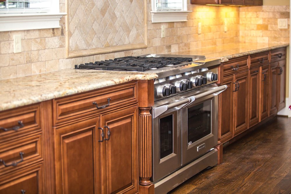 Warm wood kitchen with granite counters and professional range